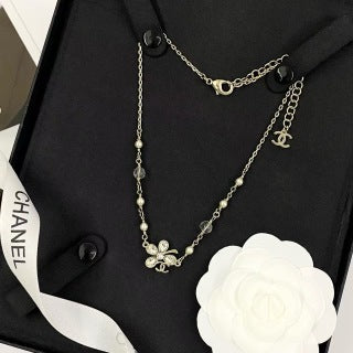 Chanel Elegant Pearl Bow Charm Necklace